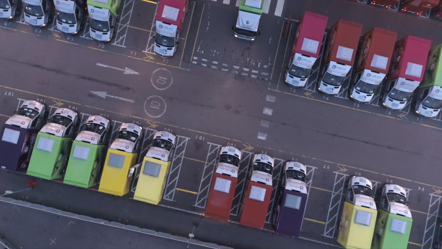 Line of vans from above in a car park