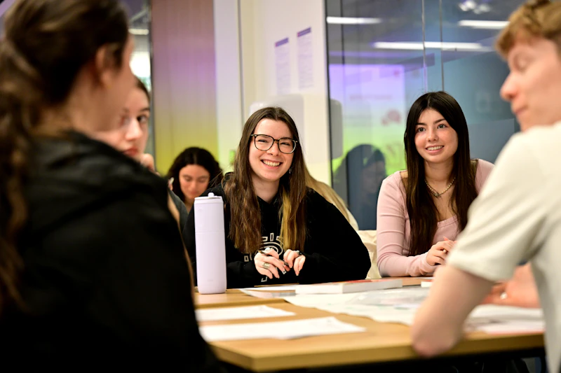 A group of young students sat down talking
