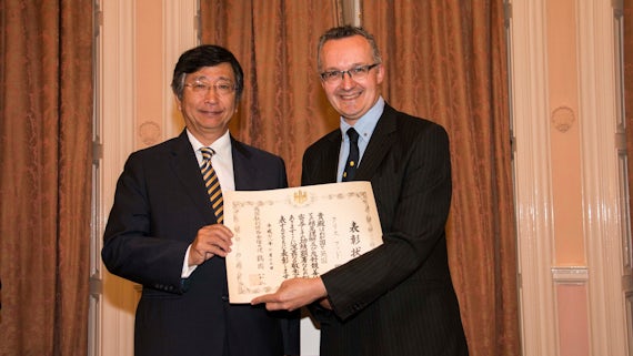 Dr Christopher Hood is presented with his Certificate of Commendation by the Ambassador of Japan, Koji Tsuruoka.