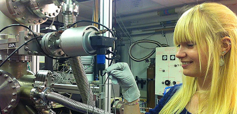 Research student sets up an ultra high vacuum evaporator