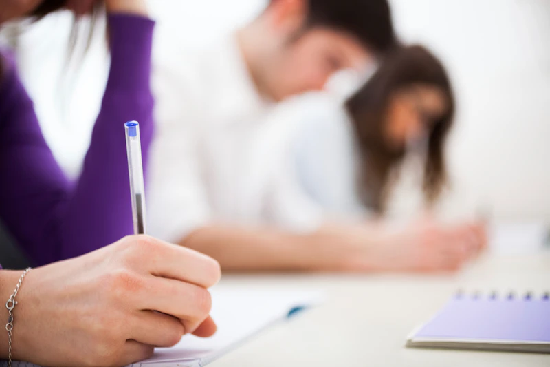 Woman writing on paper