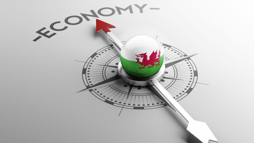 Compass with Welsh economy concept