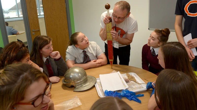 Dr David Wyatt with pupils from Cardiff West Community High School