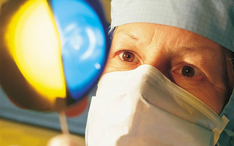 Technician holding semiconductor wafer