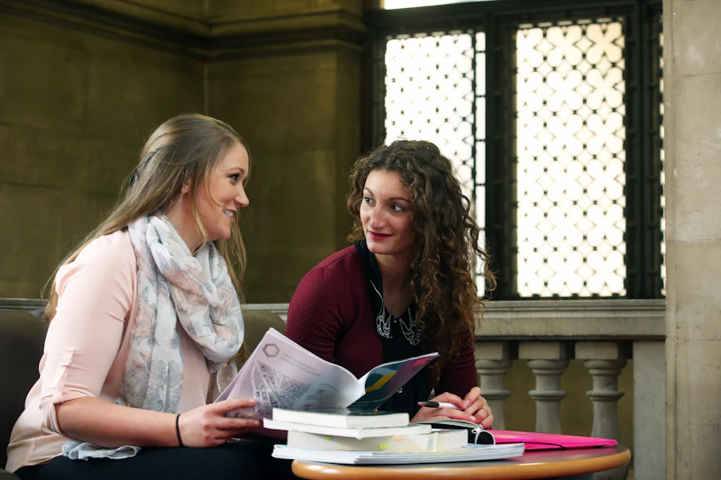 Postgraduate students discussing study options