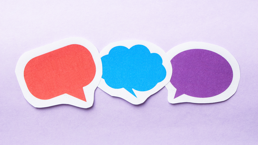 Image of three speech bubbles on a pale purple background