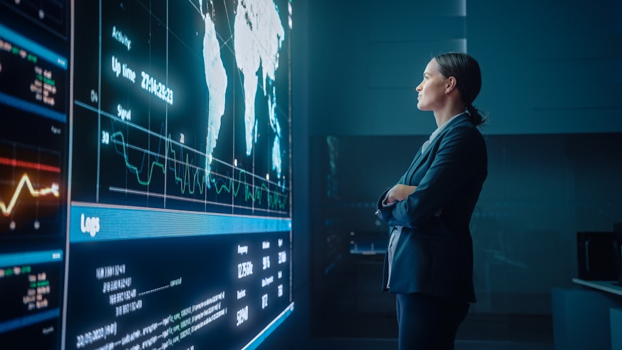 Woman standing in front of data