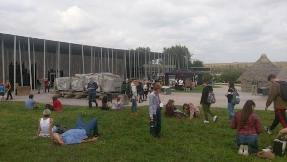 People relaxing in one area of the Big Feast Weekend festival at Stonehenge.