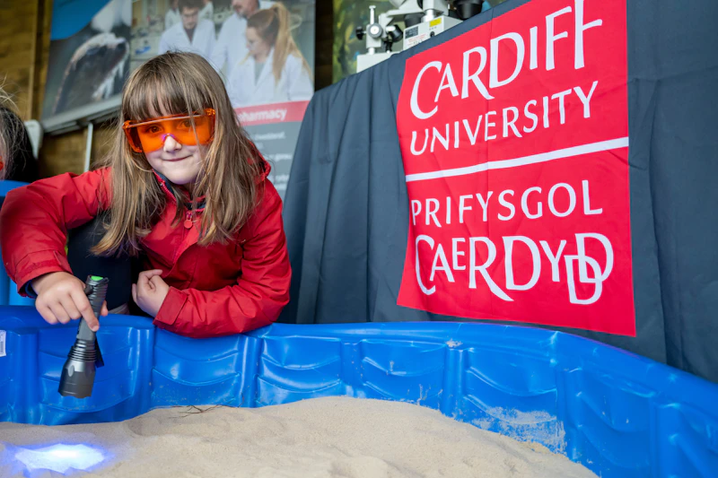 A young visitor to the Science and Technology Village takes part in a microplastics experiment