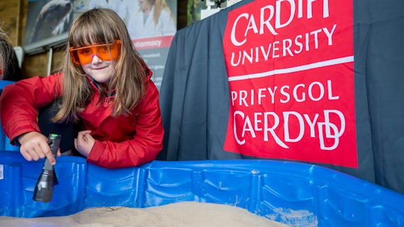 A young visitor to the Science and Technology Village takes part in a microplastics experiment