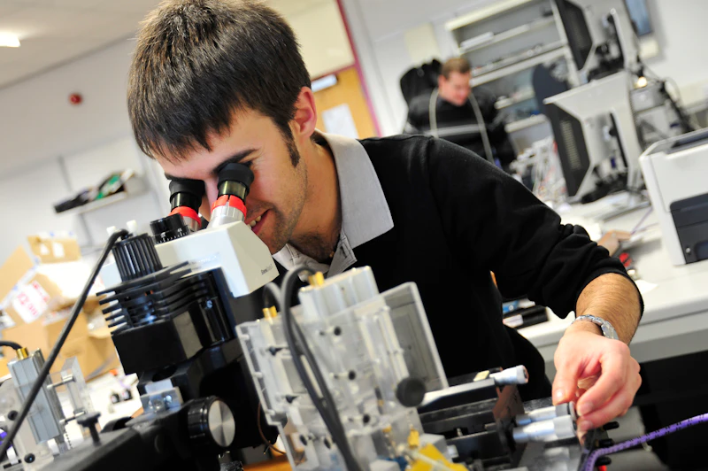 Researcher with microscope
