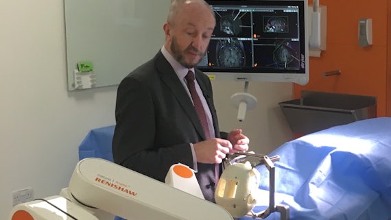 Professor William Gray performing procedure with Neuromate