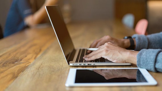 Image of person using laptop