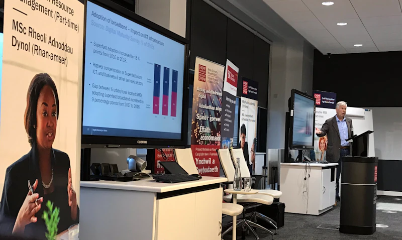 Man presents in Executive Education Suite