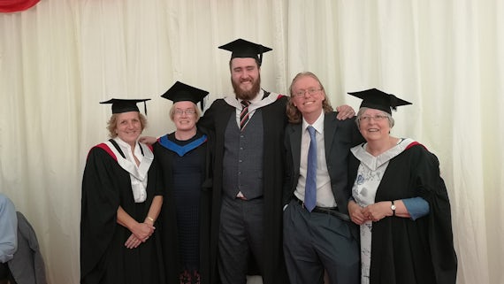 Former Exploring the Past students pictured with Dr Paul Webster in 2019