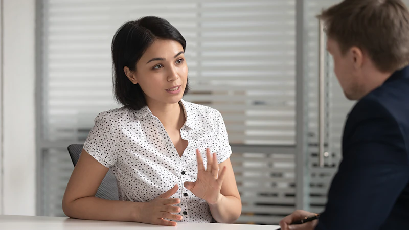 Female giving legal advice to client