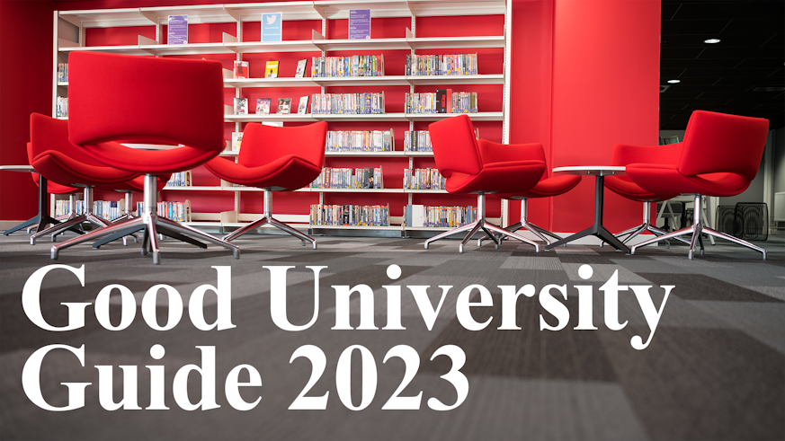 Empty red chairs with white writing saying Good University Guide 2023