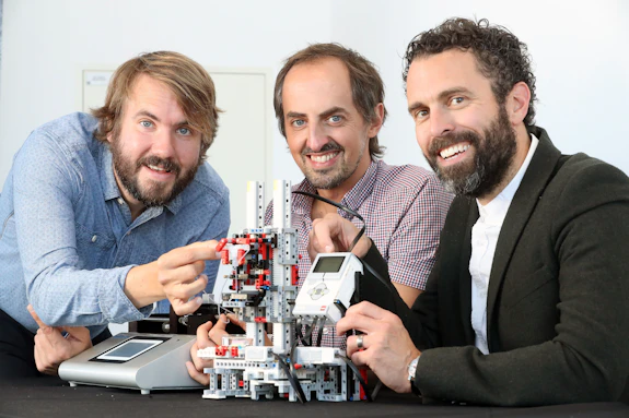Dr Christopher Thomas, Dr Oliver Castell and Dr Sion Coulman with their bioprinter built entirely from LEGO