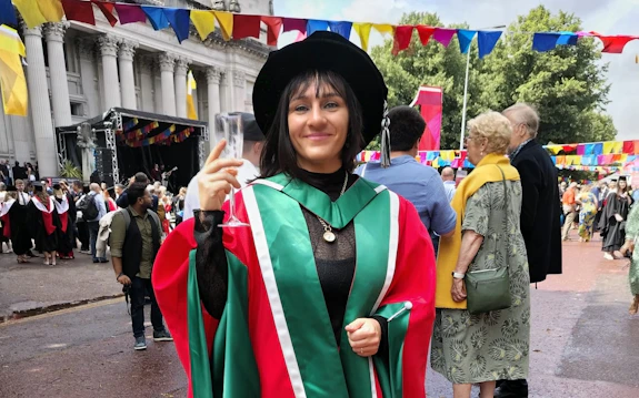  woman wearing graduation gown
