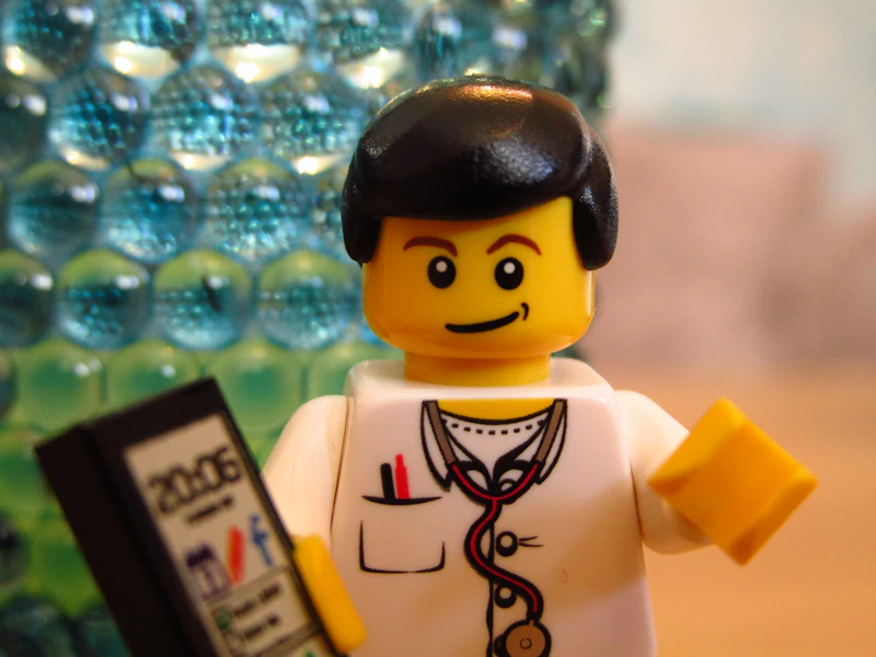 Lego doctor with mobile phone