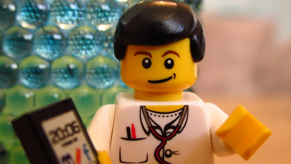 Lego doctor with mobile phone