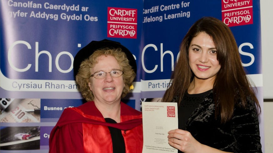 Fatma Pinar John receiving her Foundation certificate to Pathway to Business Management from Professor Elizabeth Treasure