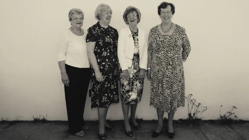 Four Women's Institute members laughing