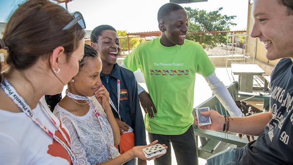 Namibian students laughing at a card trick