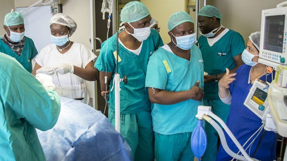 Phoenix Project's Najia Hasan teaching anaesthetics to Namibian medical officers in Rundu's operating theatre.