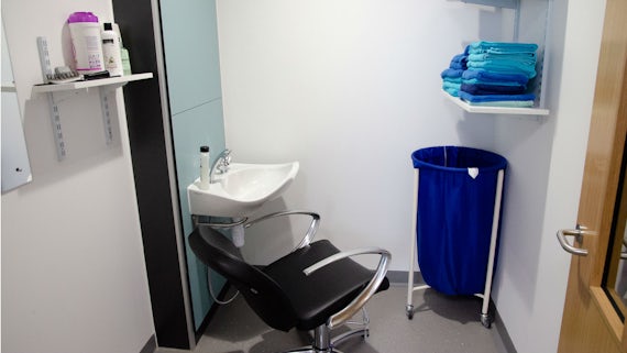 EEG hair washing facilities comprised of a convenient wash sink, chair and towels