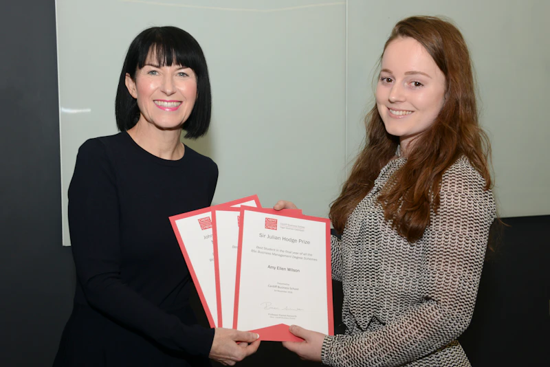 Female student presented with certificates