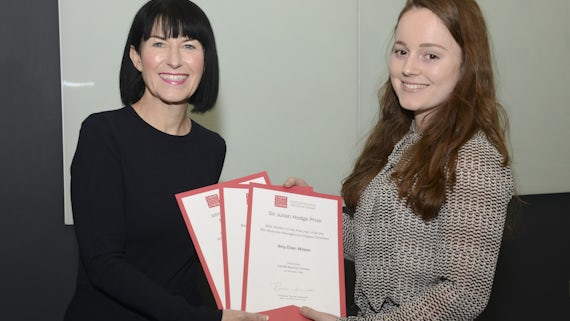 Female student presented with certificates