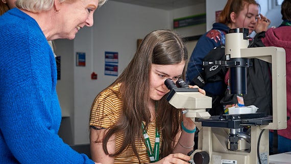 Student using microscope