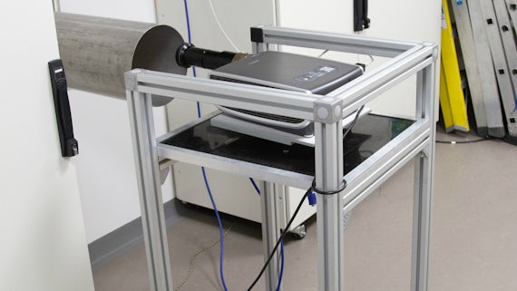Custom built project holder table with a projector on top for the mri lab