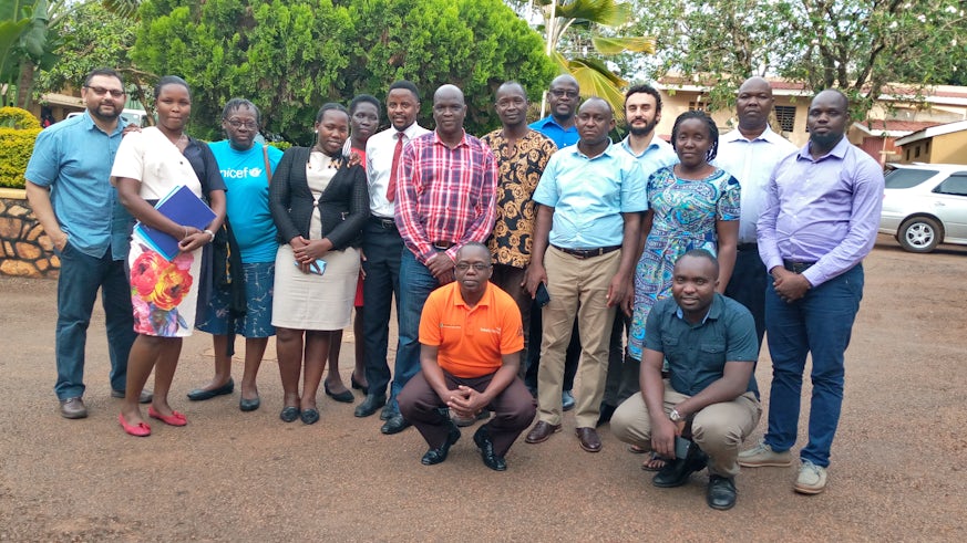 Dr Marco Pomati and Dr Shailen Nandy with researchers in Uganda