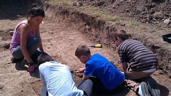 Local school pupils excavate at Caerau hill fort in southeast Wales.
