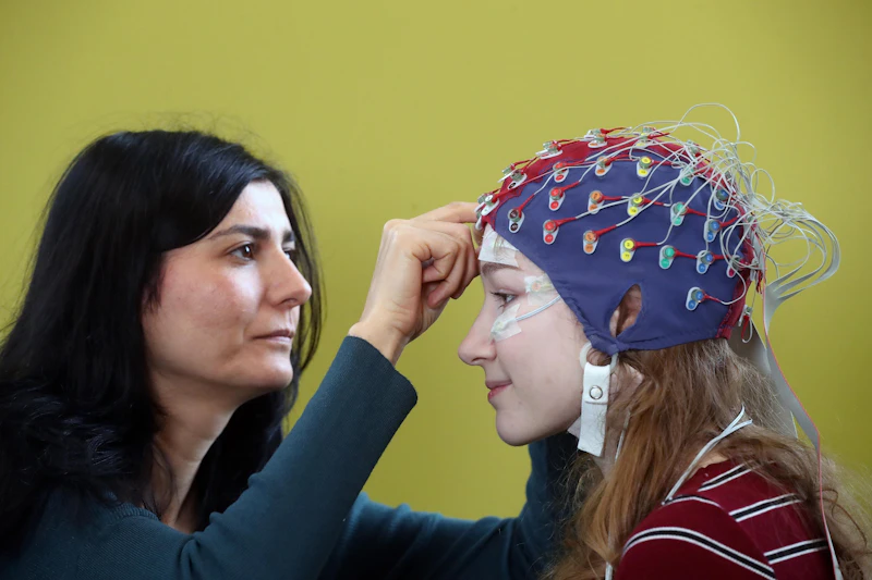 Students carrying out electroencephalography (EEG)