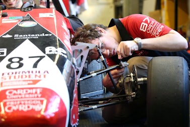 Mechanical engineering student works on Formula Student car