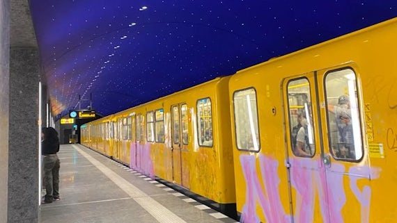 Yellow train carriages in a U-Bahn station in Berlin
