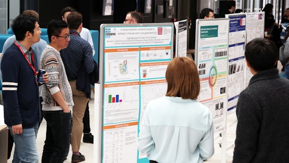 People reading scientific research posters