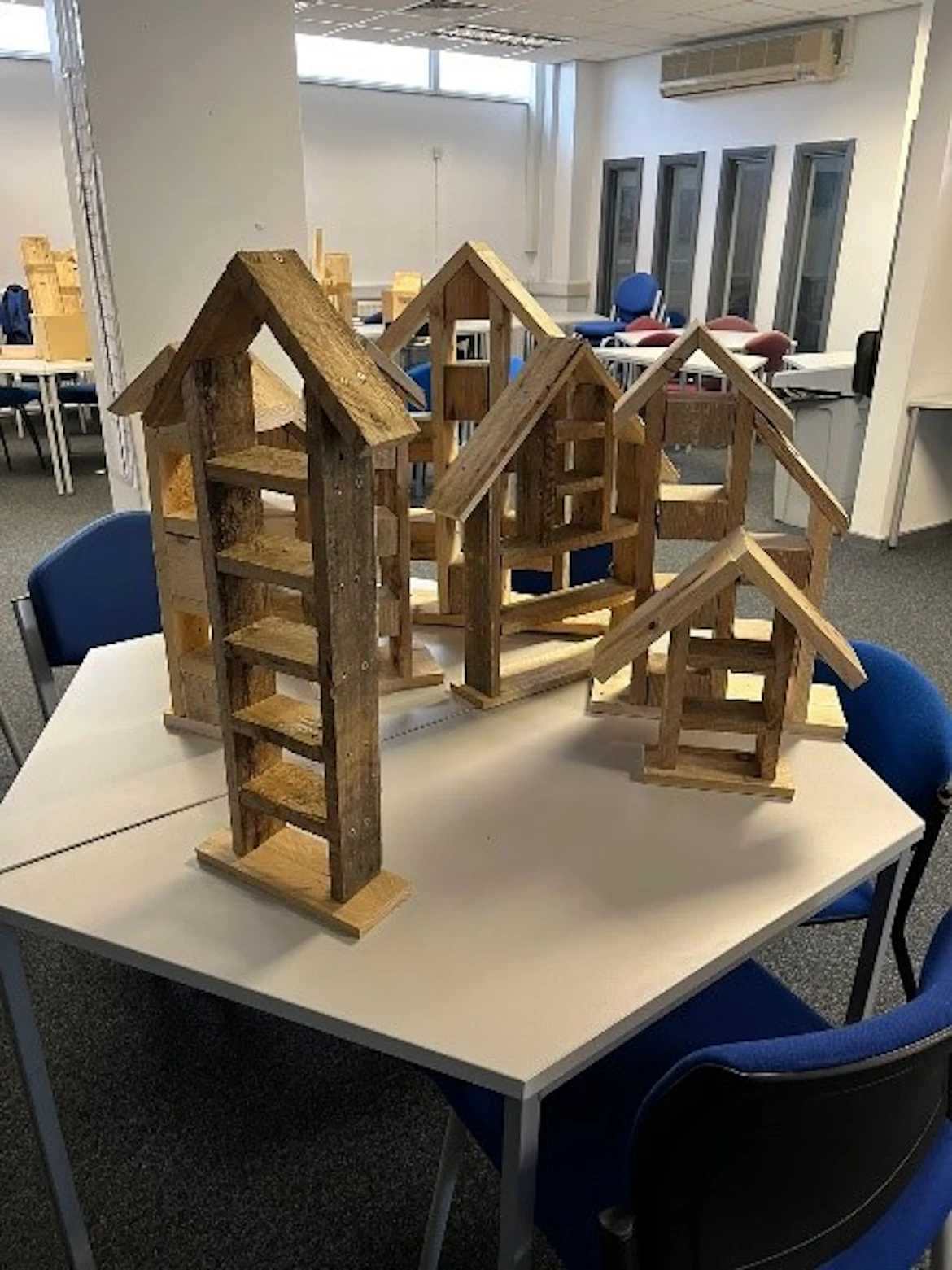 A table with partly constructed insect hotels on it