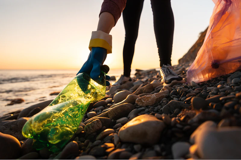 Collecting plastic waste on a beach
