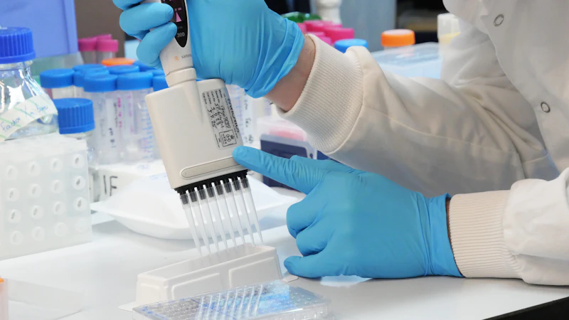 Liquid being pipetted into test tubes