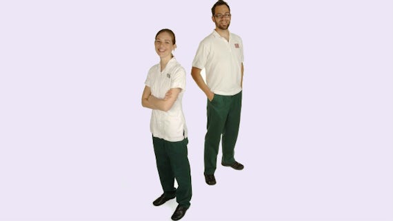 Male and female student modelling occupational therapy uniform for School of Healthcare Sciences