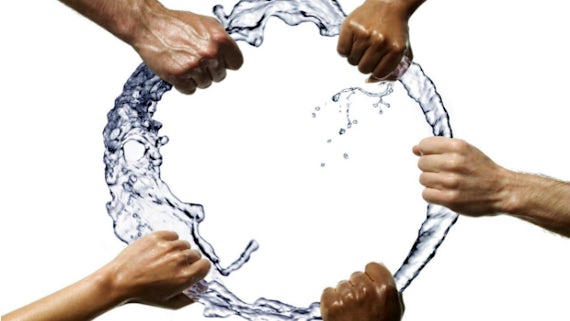 Hands holding ring of water