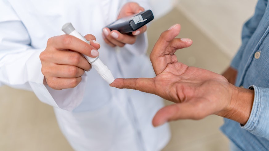 Doctor administring diabetes needle
