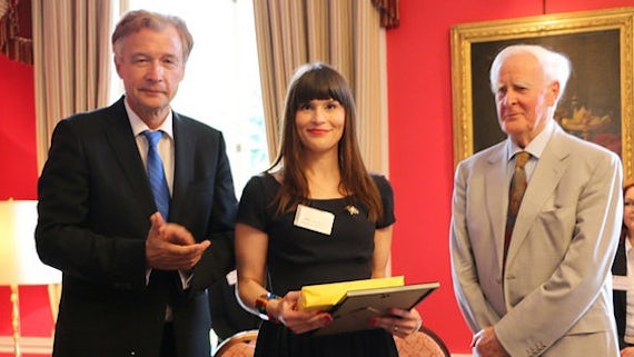 Chloe Samuels (centre) is presented with her German Teacher Award by German Ambassador Dr Peter Ammon (left) and renowned writer John le Carré (right).