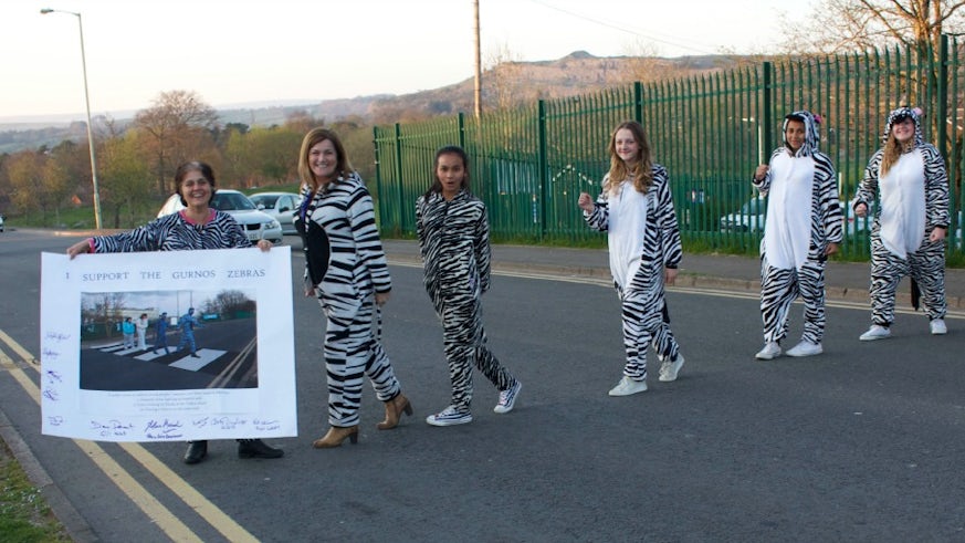 Young people from Merthyr Tydfil dressed in zebra onesies