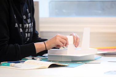 Student creating an architectural model