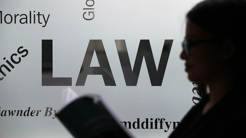 Frosted glass window with the word 'law'